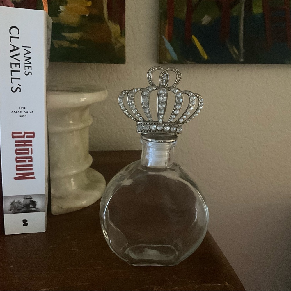 Elegant Crown-Topped Glass Bottle